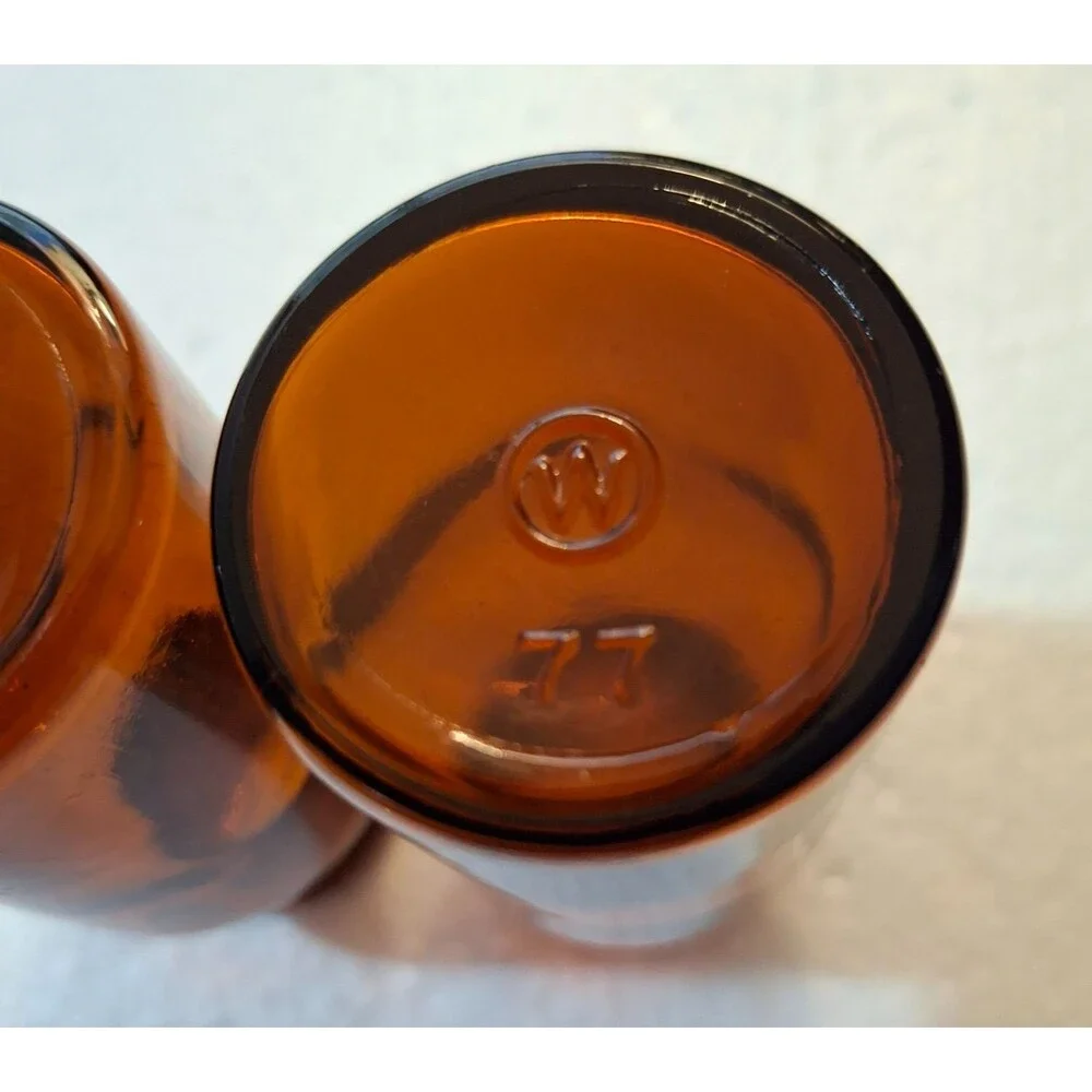 2 W Encircled Amber Glass Bottles 3 3/8